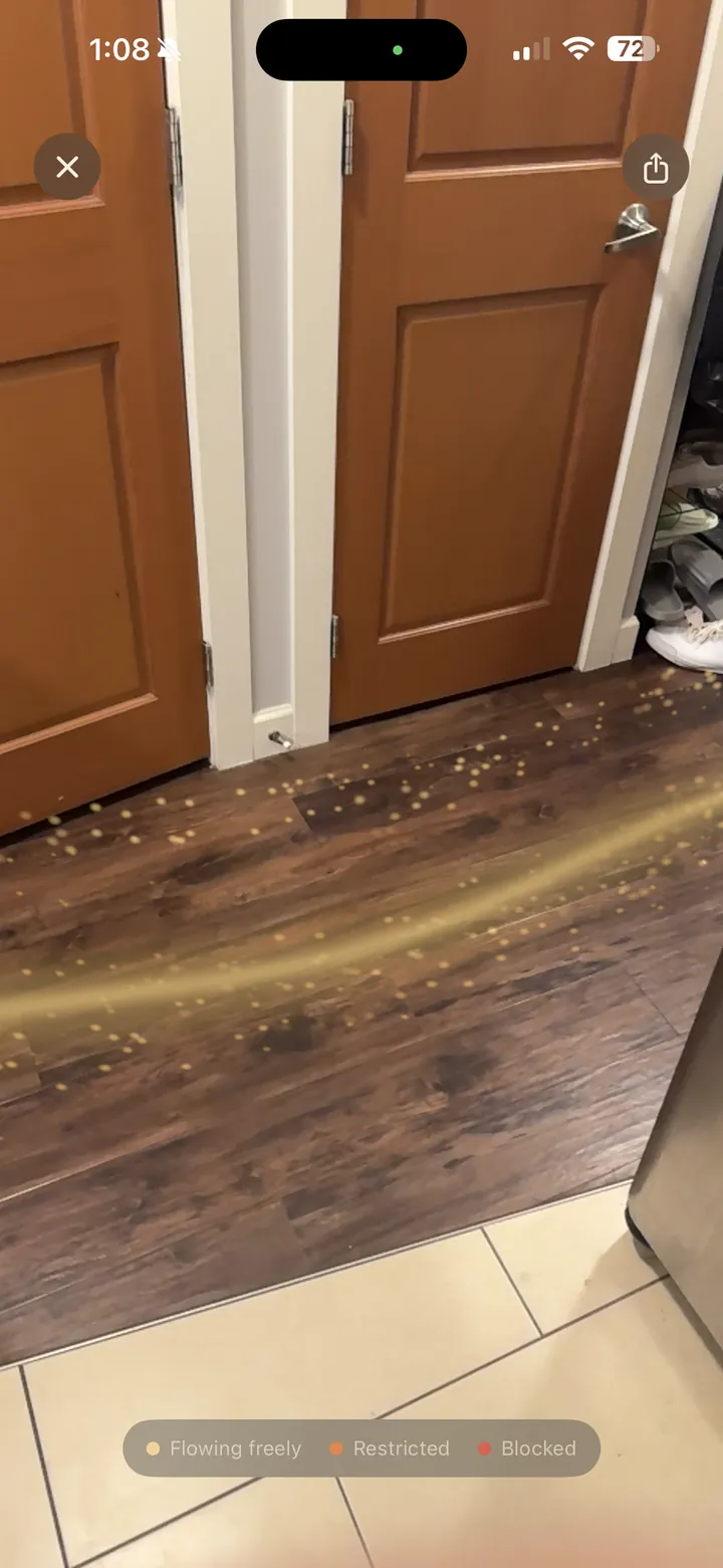 Feng Shui AR showing the flow as moving light across a real floor in AR